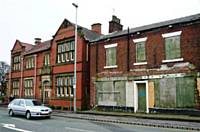 A view of the derelict building on  Manchester  Road next to the library.  Photo D Shreeve